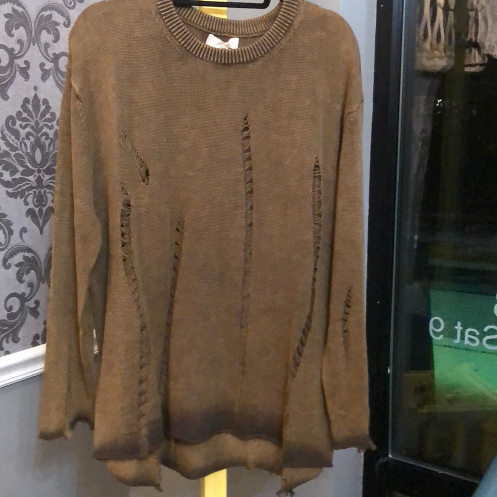 Distressed sweater is another client favorite.